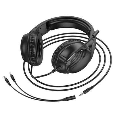 Black headphones with a long cable on a white background